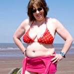 Second pic of Mature UK plumper Speedy Bee takes off her bikini top during a trip to the sea