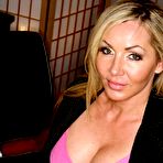 First pic of Big titted sex teacher Lisa DeMarco stripping from silk lingerie