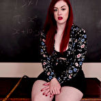 First pic of Pale redhead Jaye Rose picks up a cane while disrobing on a desk