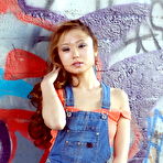 First pic of Petite Asian teen Gretchen stands naked against a graffiti covered wall