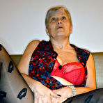Second pic of Older granny Savana pulls down hot pantyhose to rub clit with saggy tits out