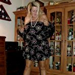 Second pic of Fat grandmother with blonde hair exposes herself in tan nylons and garters