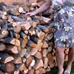 First pic of Brazen older granny strips off by the wood pile to show off BBW tits & big ass