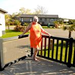 First pic of Fat nan bares her boobs while in a patio hot tub before getting naked on a bed