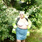 Second pic of Fat British woman Grandma Libby exposes herself by a tree in a park