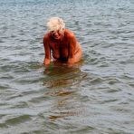Second pic of Mature granny Dimonty skinny dipping at the beach with big saggy tits hanging