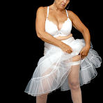 Second pic of Brazen plump granny Savana flashes panty upskirt in tutu & sparkly high heels