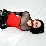 Fourth pic of Geeky girl finds herself hogtied in a latex miniskirt and glasses