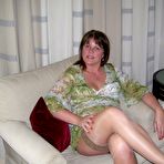 First pic of Mature lady Cassandra Uk slides her panties aside after showing her nipples