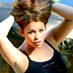 Fourth pic of Amateur model Dorothy piles up her hair at end of a sfw shoot in a miniskirt