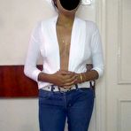 Fourth pic of Indian MILF displays her natural tits while wearing blue jeans