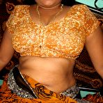 Second pic of Mature Indian housewife sticks out her tongue while unveiling her natural tits