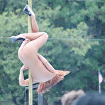 Fourth pic of Caucasian strippers put on an outdoor show at a clothing optional club