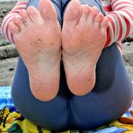 Second pic of Busty mature woman Tasty Trixie goes barefoot at beach while exposing herself