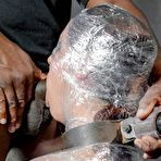 Third pic of MILF Syren De Mer is wrapped up in saran wrap before being face fucked