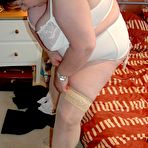 Second pic of British BBW Chris 44g dons a big hat in her underthings and nylons
