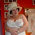 Third pic of British BBW Chris 44g dons a big hat in her underthings and nylons