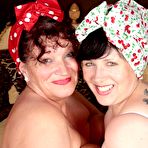 Fourth pic of Mature lesbians show off their large boobs while wearing white nylons