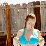 Second pic of Natural redhead Julia Fleming frees her big natural tits in above ground pool