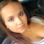 First pic of Young looking Latina girl Olivia hides her huge tits while taking selfies