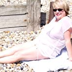 First pic of Overweight blonde Speedy Bee looses her tits and twat from a bikini at a beach