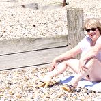 Fourth pic of Overweight blonde Speedy Bee looses her tits and twat from a bikini at a beach