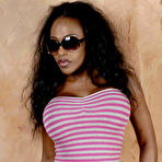 First pic of Ebony model Feline Wood plays with her long hair while wearing sunglasses