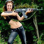 Second pic of Latina teenager Gigi Rivera goes topless while firing off a rifle in woods