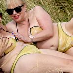 Second pic of Old lesbians catch rays on their large breasts while sunbathing in a field