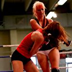 Third pic of Sporty lesbian chicks have some non nude catfight fun in the ring