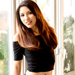 First pic of Asian model Melody Wylde gets completely naked afore a window