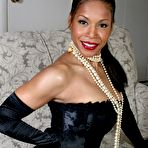 Third pic of Ebony mature Semmie Desuora revealing her melons from a classy corset dress