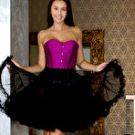 First pic of Brunette teen Alisa Amore doffs a corset and tutu skirt to model totally naked