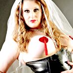 First pic of Redheaded bride sports nipple pasties in a black latex corset