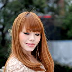 Fourth pic of Hot Japanese girl with red hair Reika Kitahara poses outdoors in a short dress