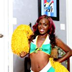 Second pic of Ebony cheerleader Bella Doll frees her small tits and pussy from her uniform
