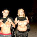 Fourth pic of Three girls flash their natural tits while walking a city street at night