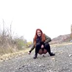 Third pic of Natural redhead Katie Rose gets caught taking a piss upon a gravel road