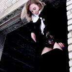 Third pic of Blonde girl Alice Klay pisses in a window frame on a winter's day