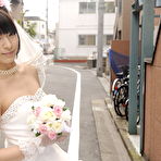 Fourth pic of Beautiful Japanese bride Ruri Narumiya poses on the street during her big day