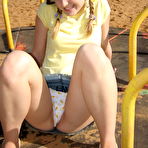 Second pic of Cute teen exposes her bra and upskirt panties while at a playground