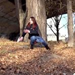Third pic of Solo girl Amanda Hill pulls down her jeans for a pee behind a tree in public