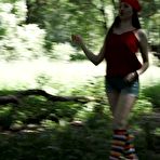 First pic of Young blonde Larisa takes a pee behind a tree in multi-coloured knee socks
