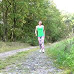 First pic of European female Valentina Ross squats for a pee while strolling a country road