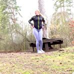 First pic of Blonde girl Delphine takes a piss upon a platform while out in nature