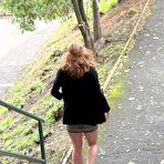 Fourth pic of Natural redhead Chrissy Fox squats for a pee on a set of public steps