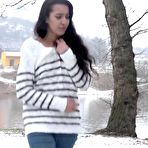 First pic of Brunette chick Esperansa pees against a tree upon snow-covered ground