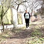 First pic of Naomi Bennet squats for a badly needed pee on a path behind a building
