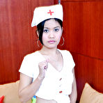 First pic of Petite Latina nurse Joana lifting top to expose small breasts
