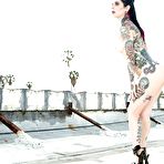 Third pic of Amateur female Joanna Angel showing off heavily tatted body on rooftop
